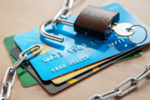 Credit cards with an open lock and chain. Open access to the use of electronic money credit - subscription credit lines