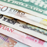 Various paper currencies, courtesy of Getty Images.