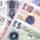 Photo of British pound bills.