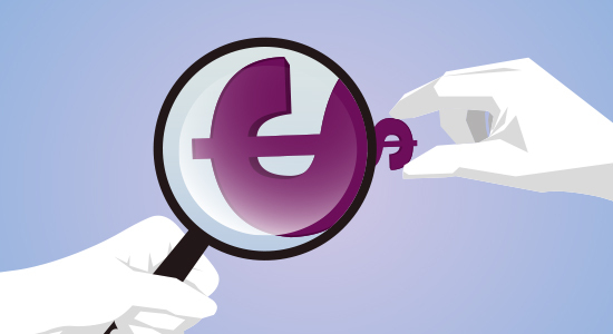 Dollar sign under magnifying glass