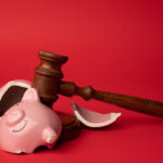 piggy bank broken with gavel