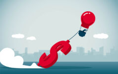 Money holding down a hot air balloon
