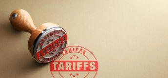 Wooden tariffs stamp, from Getty Images.