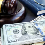 King & Spalding continues fund finance buildout Litigation finance. Gavel and dollar banknotes. Bail bonds.