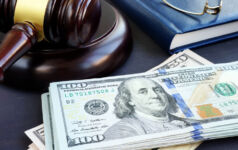 King & Spalding continues fund finance buildout Litigation finance. Gavel and dollar banknotes. Bail bonds.