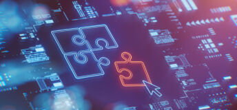 Picture of a computer screen showing a jigsaw puzzle, representing tech M&A.