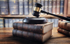 Mercury Capital wins ruling in racial discrimination case Judge gavel and law books in court, law and justice background concept