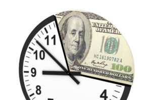 A combo illustration of a block and $100 bill.