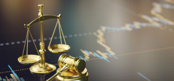 A courtroom gavel and golden scales of justice on a financial analysis chart, representing legal and economic themes.