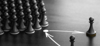 Puzzle pieces on a board with arrows, symbolizing planning.