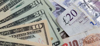 An image of paper US dollars and UK pounds together.
