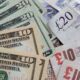 Spin-outs enjoy an edge in GP financing An image of paper US dollars and UK pounds together.