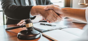 Businessman shaking hands to seal a deal Judges male lawyers Consultation legal services Consulting in regard to the various contracts to plan the case in court.