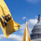 In the Loop: Blue skies, red lines Image of a Gadsden flag waving in front of the White House.